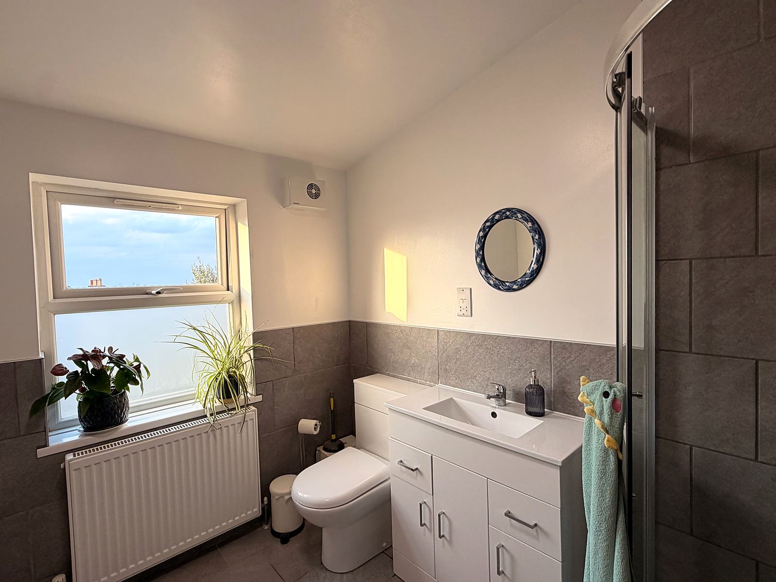 Damp-damaged bathroom repainted and redecorated