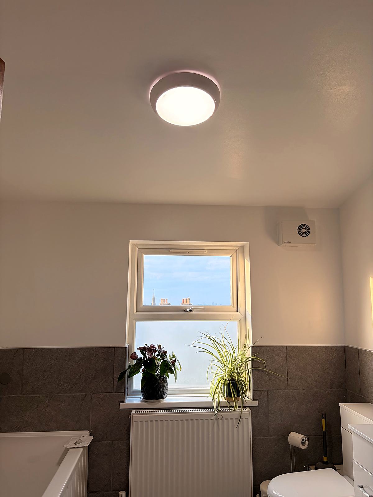 Damp-damaged bathroom repainted and redecorated