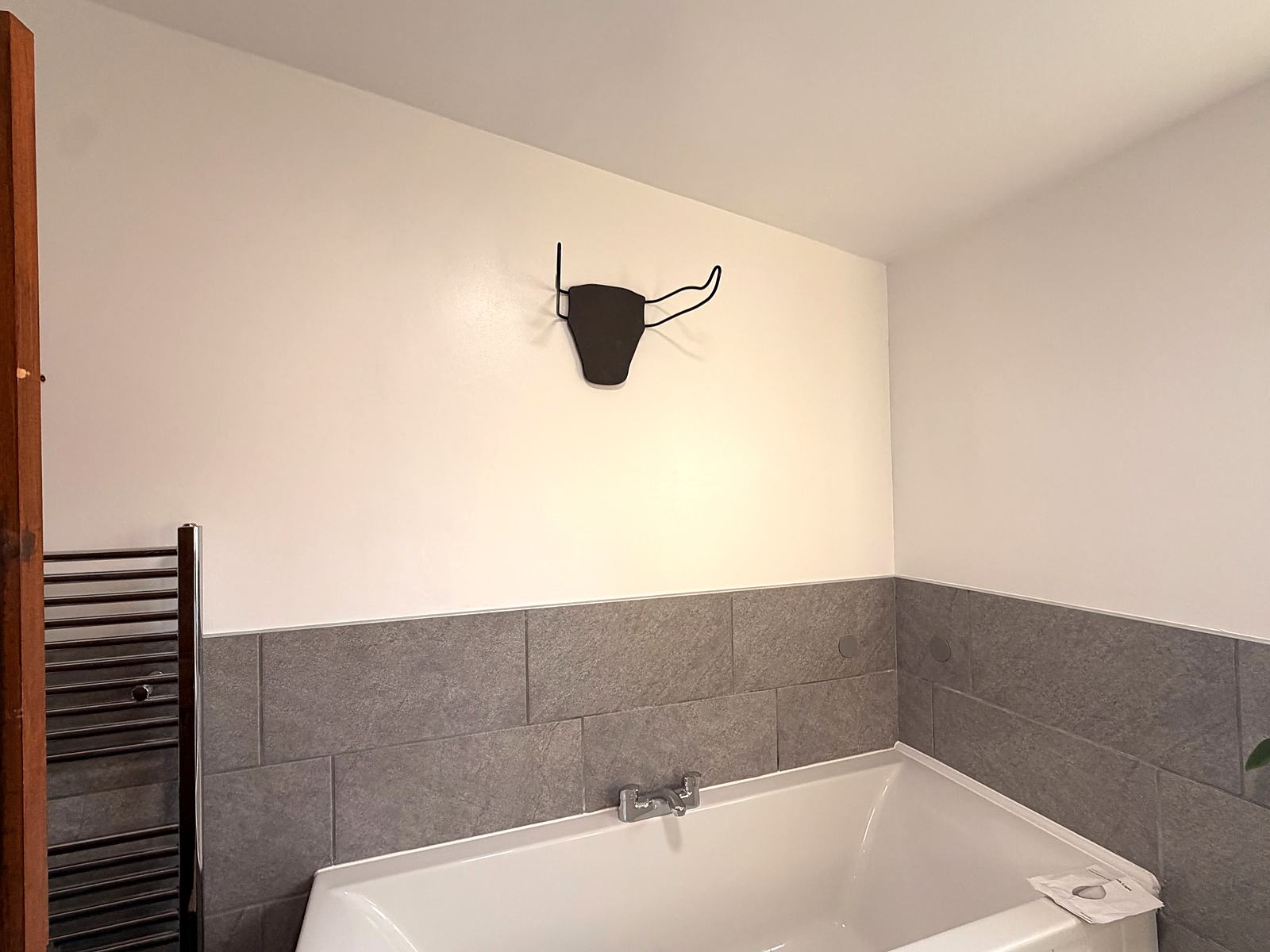 Damp-damaged bathroom repainted and redecorated