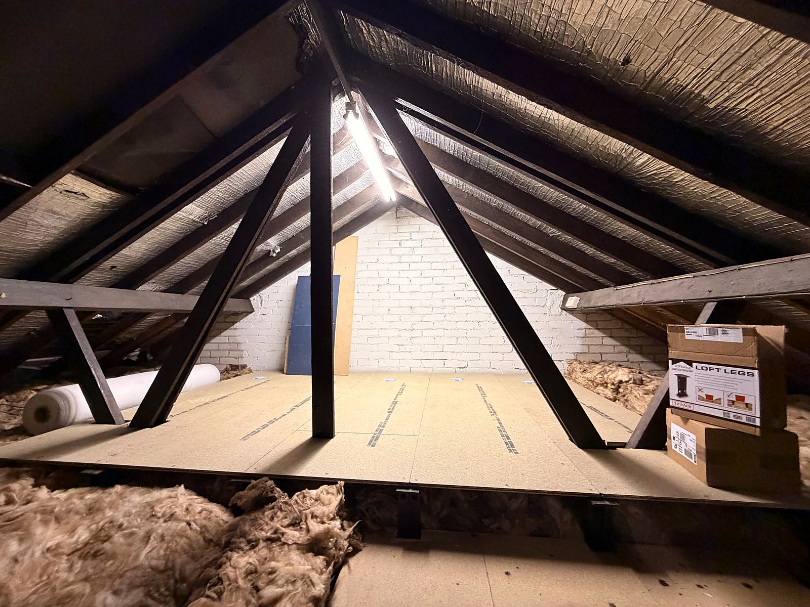 Raised loft floor on loft legs